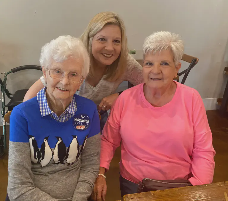 Deneen, founder of Home Companion, smiling with a client